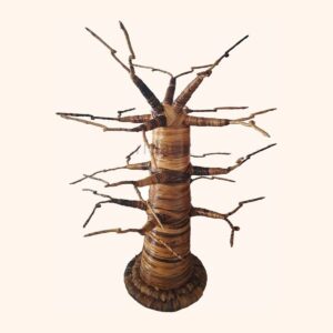A baobab tree sculpture wrapped in natural banana fibre, with a thick trunk, spreading branches and a round woven base.