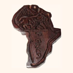 A small dark wooden plaque cut in the shape of Africa, hand-carved with a lion and the word Africa.