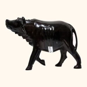 A polished dark wood carving of a walking buffalo with detailed horns and mane.