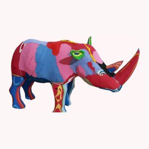 A rhino sculpture carved from multicoloured flip-flop rubber in red, pink, blue and yellow.