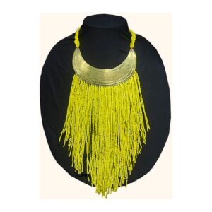 A statement necklace with an engraved brass crescent collar and long cascading strands of yellow beads, shown on a black display bust.