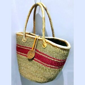 Woven natural sisal basket bag with a red stripe, leather-wrapped handles and a leather button fastening.