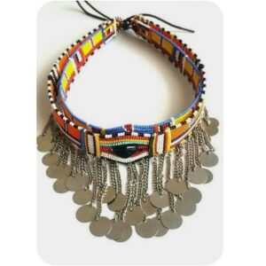 A Maasai beaded choker in bands of orange, yellow, blue, red, white and black beads, with a deep fringe of silver chains and dangling silver discs, tied at the back with leather cords.