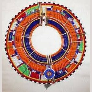 A large round Maasai beaded collar made of many concentric rings of orange, blue, red, green, white and black beads, held by beaded spacer bars, with a small beaded pendant at the front.