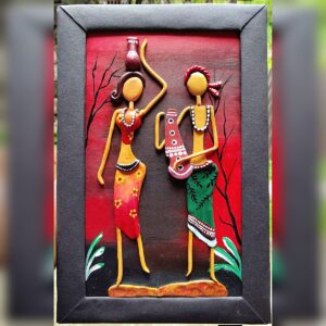 Design 1: two women carrying water pots, raised clay figures in red, orange and green on a red and black painted background in a black frame.